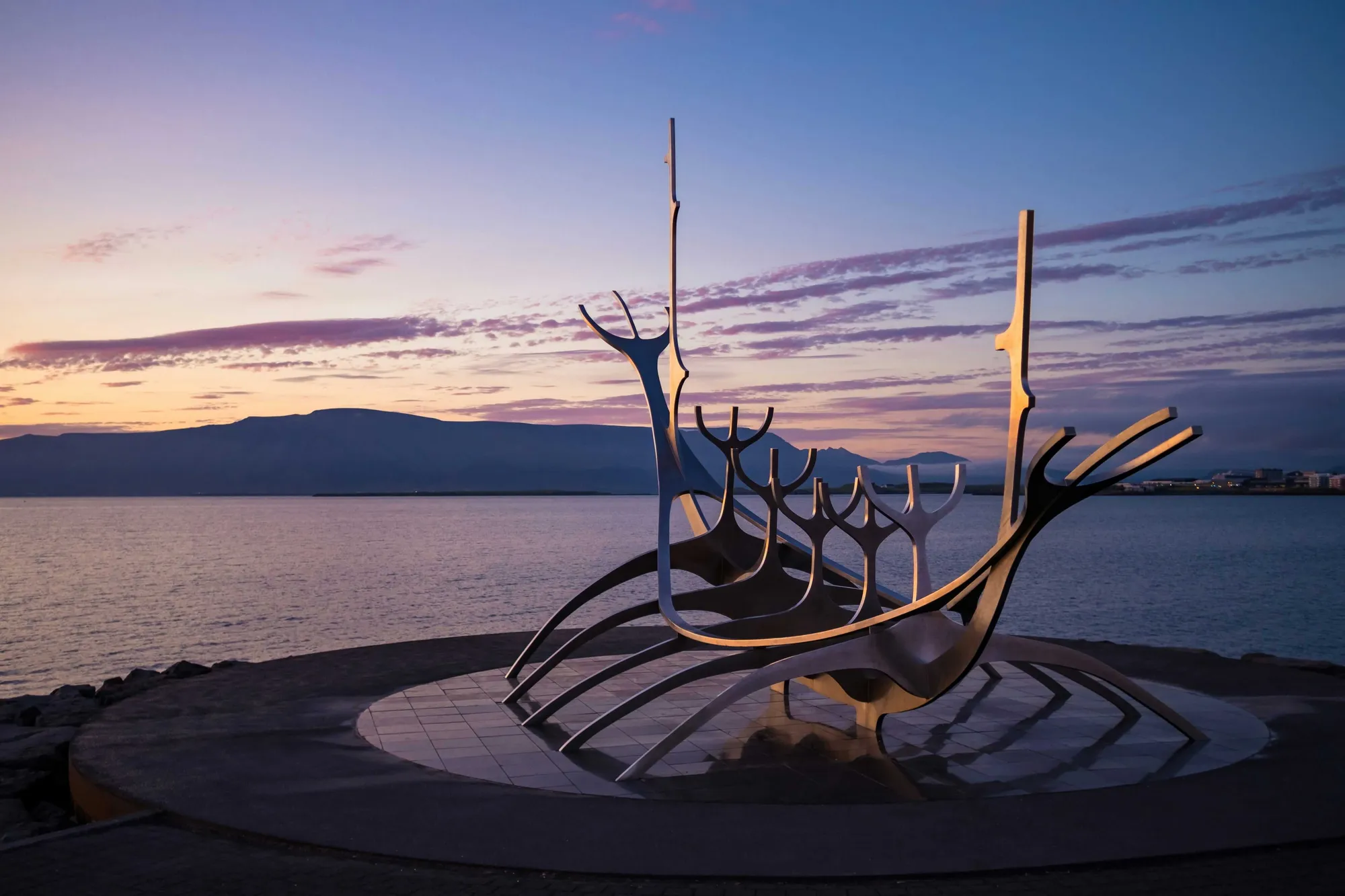 Sun Voyager sculpture on Reykjavík waterfront at sunset