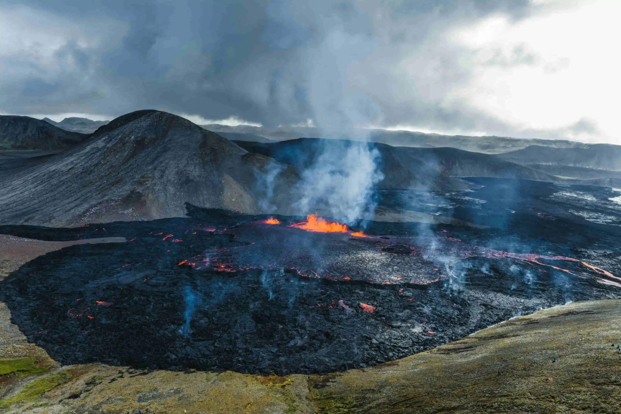 Fagradalsfjall volcanic eruption on Iceland's Reykjanes Peninsula, with lava fountains and flowing lava field