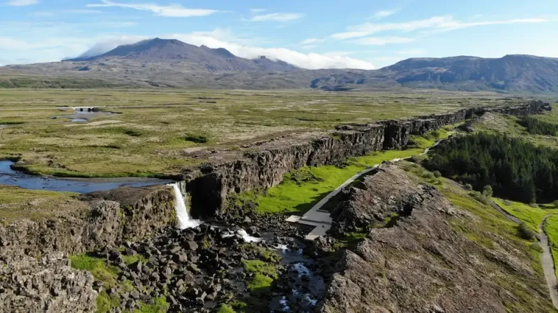 Þingvellir National Park rift valley under winter snow with frost-covered lava, southwest Iceland