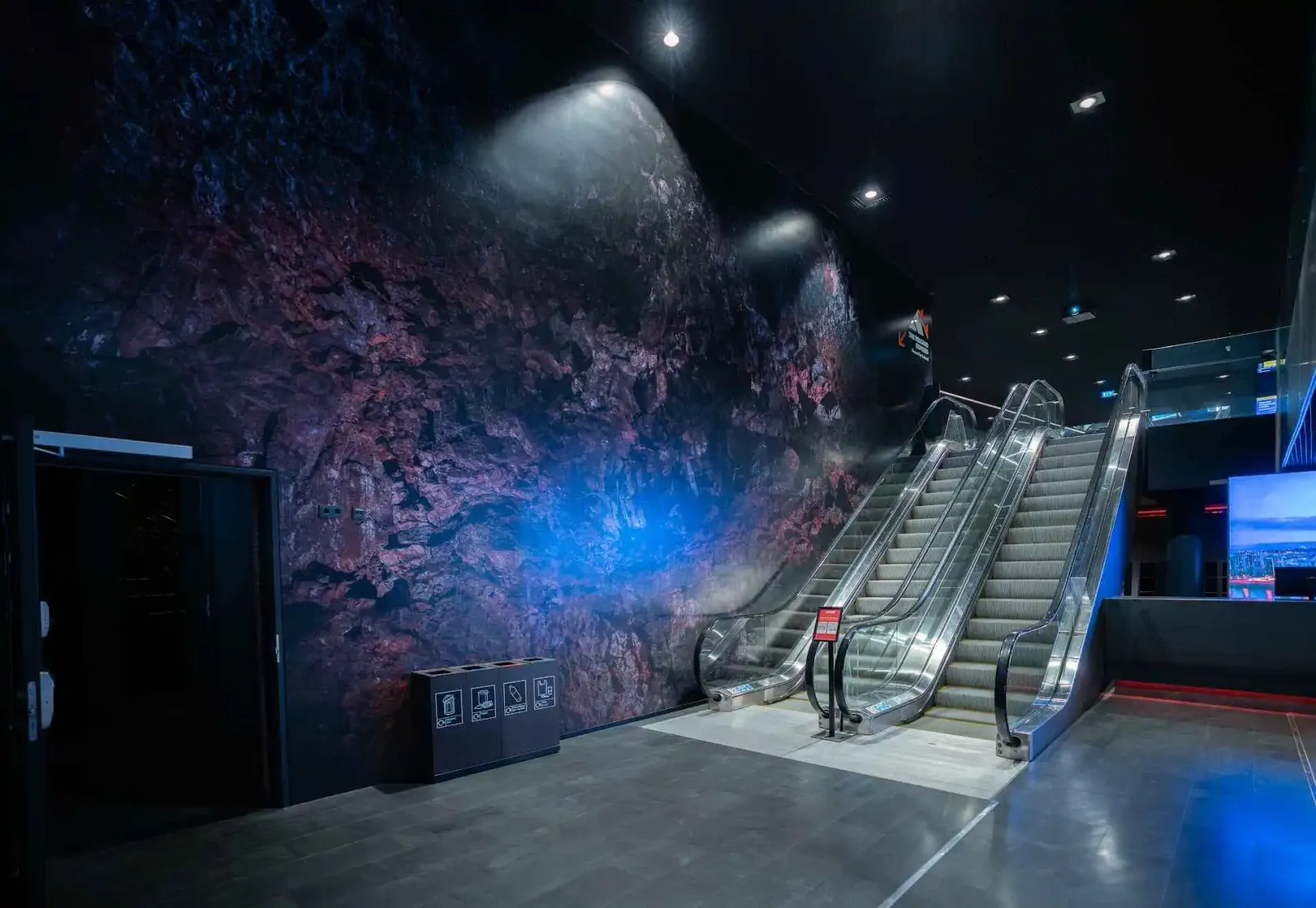 Harpa Concert Hall escalator access to floor K2 with Volcano Express signage, central Reykjavík